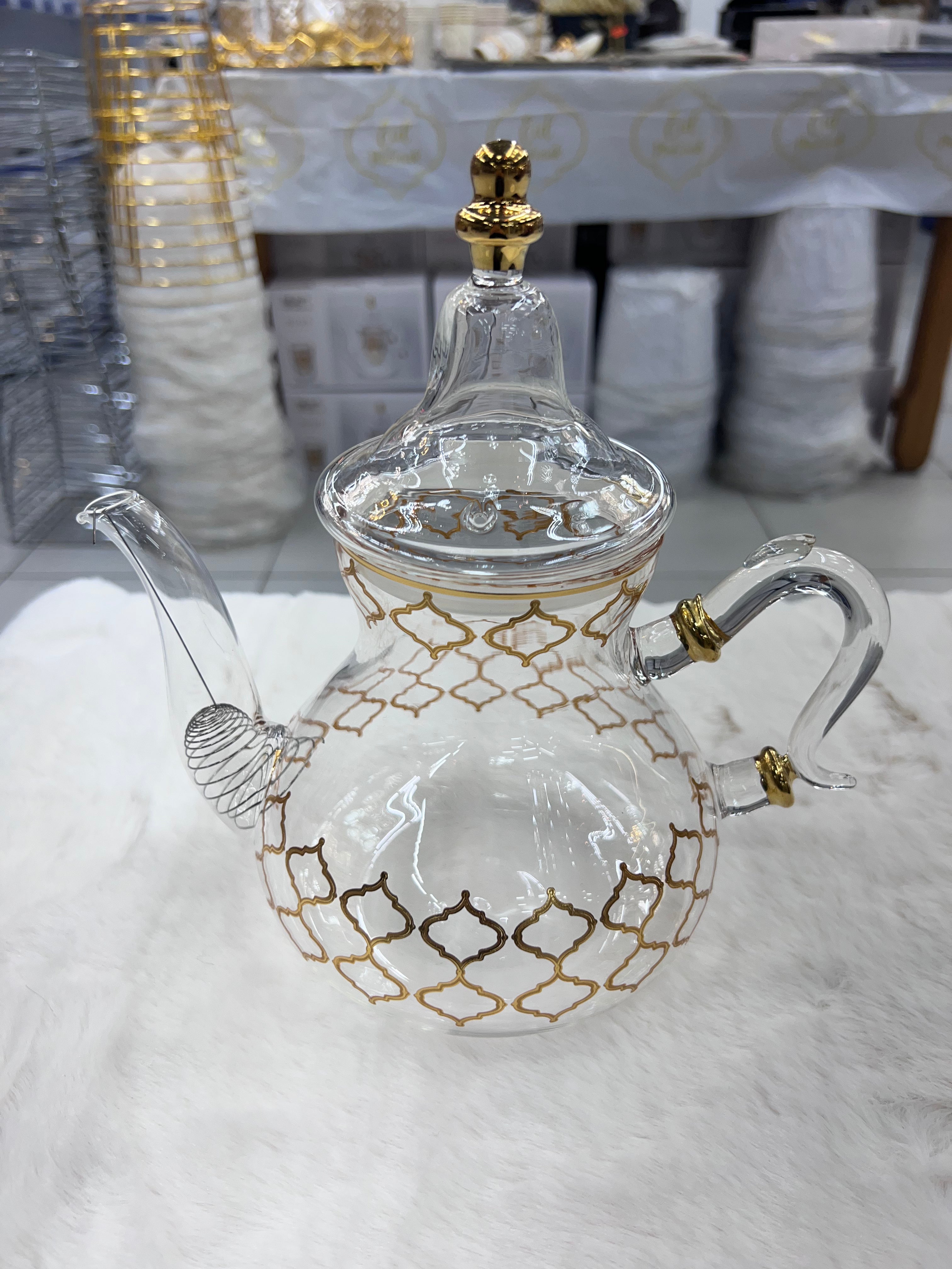 Théière transparente quadrilogue